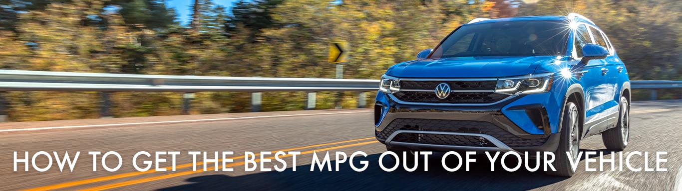 Best MPG At West Broad VW in Richmond, VA | Blue 2023 Volkswagen Taos driving down the road during the day while white text in front of it reads 'How to Get the Best MPG Out of Your Vehicle' 