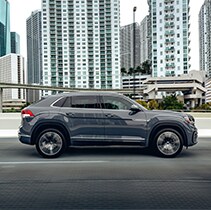 Model Features of the 2021 Volkswagen Atlas Cross Sport at West Broad VW | Side profile of Atlas Cross Sport driving in city