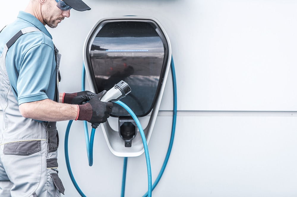 How to prepare your home for your new Electric Vehicle at West Broad Volkswagen in Richmond | Man installing home charger for elecric vehicles