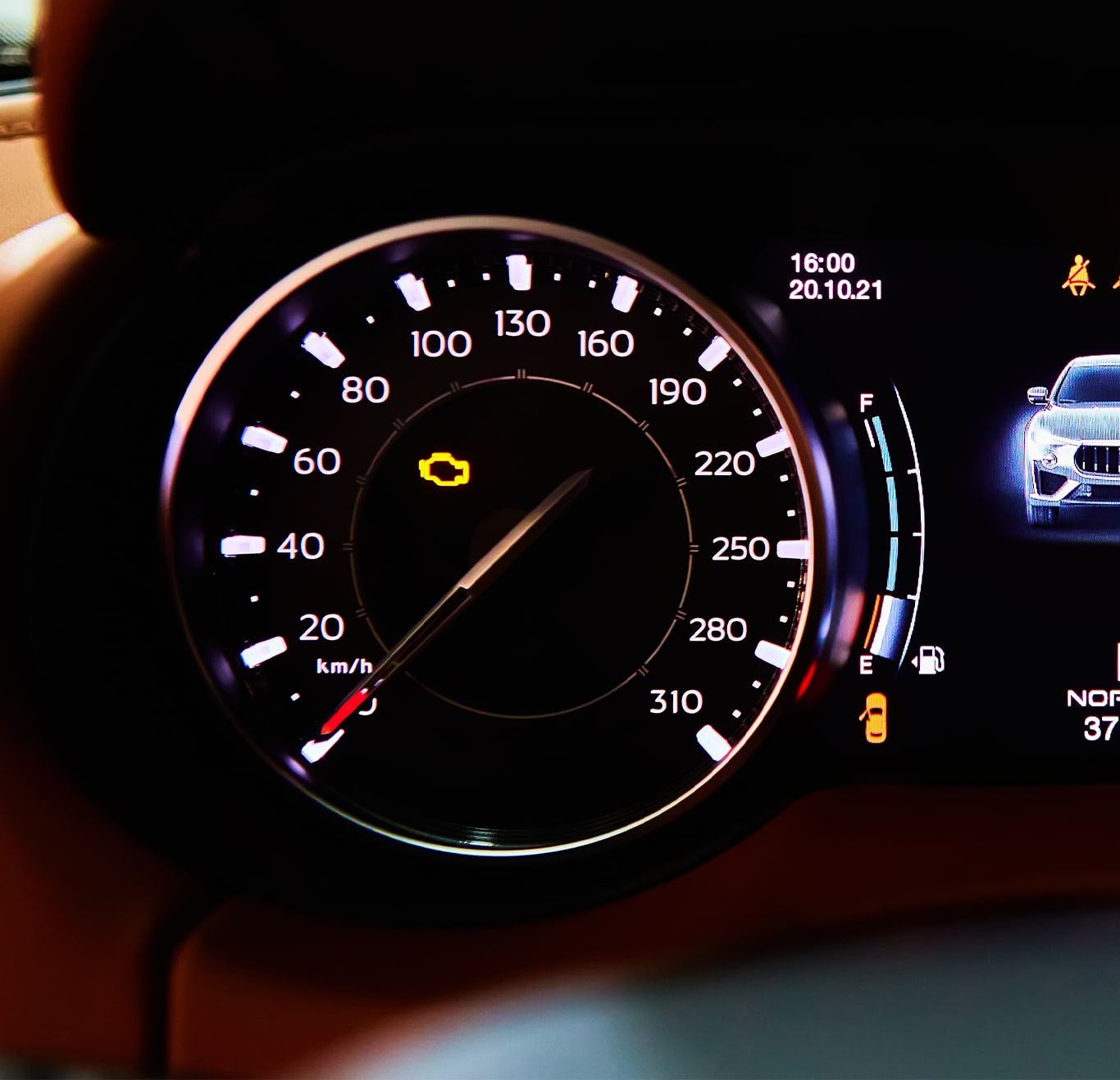 Understanding Your Volkswagen’s Emergency Lights at West Broad VW in Richmond, VA | Car dashbaord with yellow check engine light on in the center