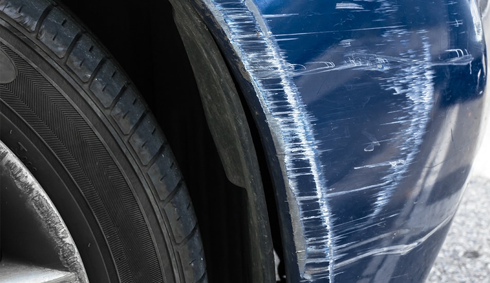 What is Paintless Dent Repair? | West Broad VW | Blue car with paint scratch on front bumper 