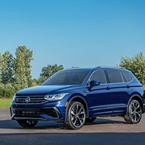 Model Features of the 2021 Volkswagen Tiguan at West Broad VW | Front left of Tiguan parked in sunlight