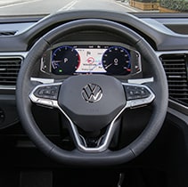 Model Features of the 2021 Volkswagen Atlas Cross Sport at West Broad VW | Close up on steering wheel and speedometer