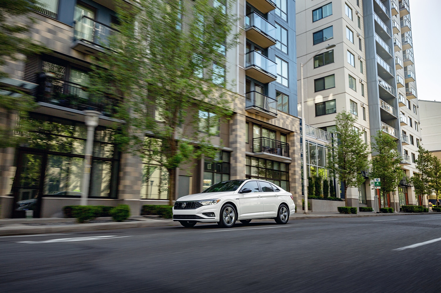West Broad Volkswagen is a Volkswagen Dealership near Petersburg, VA | 2021 Volkswagen Jetta driving though city