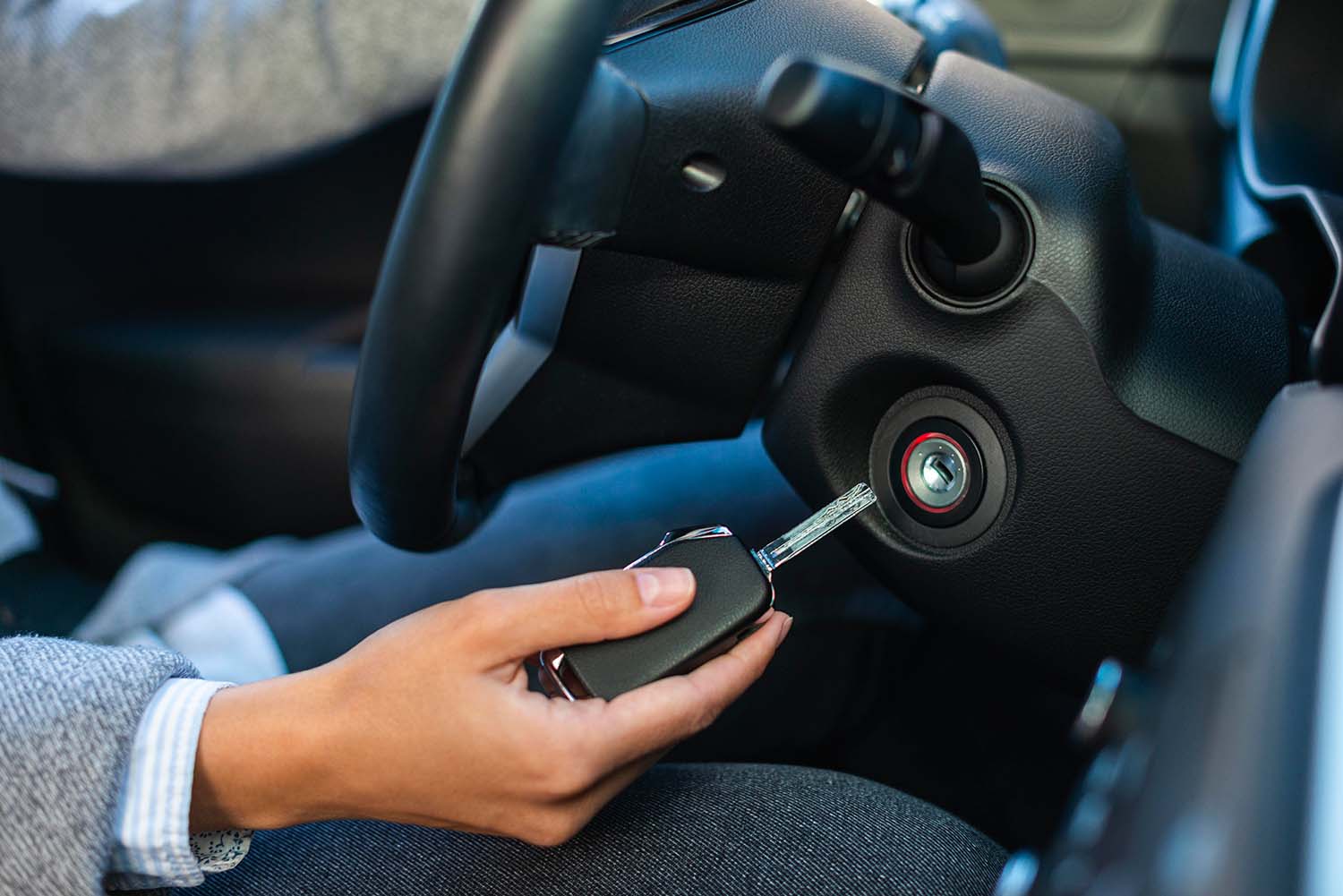 High Cost of Replacing a Car Key | West Broad Volkswagen  Woman putting new key in her car ignition