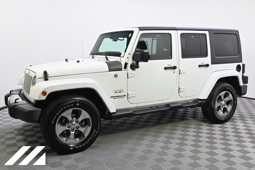 Used 2016 Jeep Wrangler Unlimited Sahara with VIN 1C4HJWEG1GL312989 for sale in Saint Louis Park, Minnesota