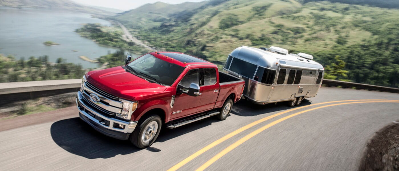 2020 Red Ford F-250 Towing a Trailer