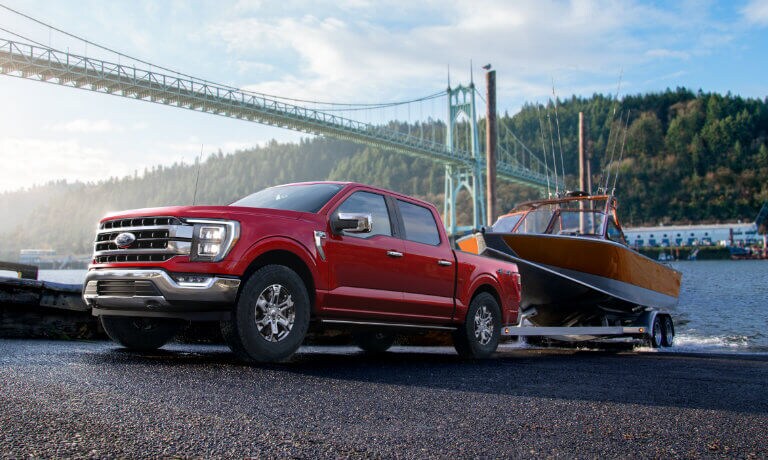2021 Red Ford F-150 Towing a Boat out of Water
