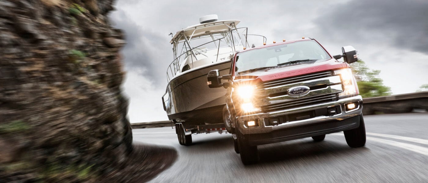 2019 Red Ford F-250 Braking Downhill while Towing a Boat