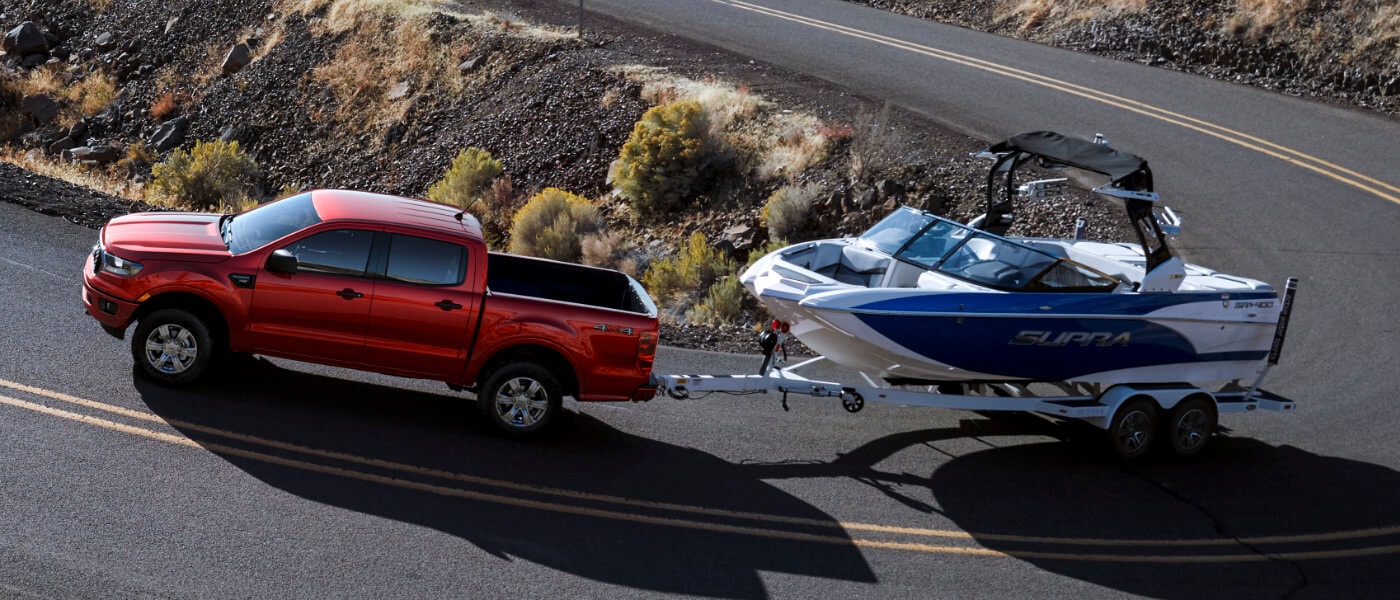 2019 Red Ford Ranger Towing a Boat