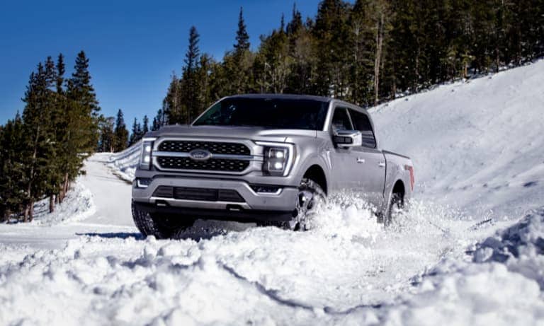 2021 Silver Ford F-150 Dirving in Snow