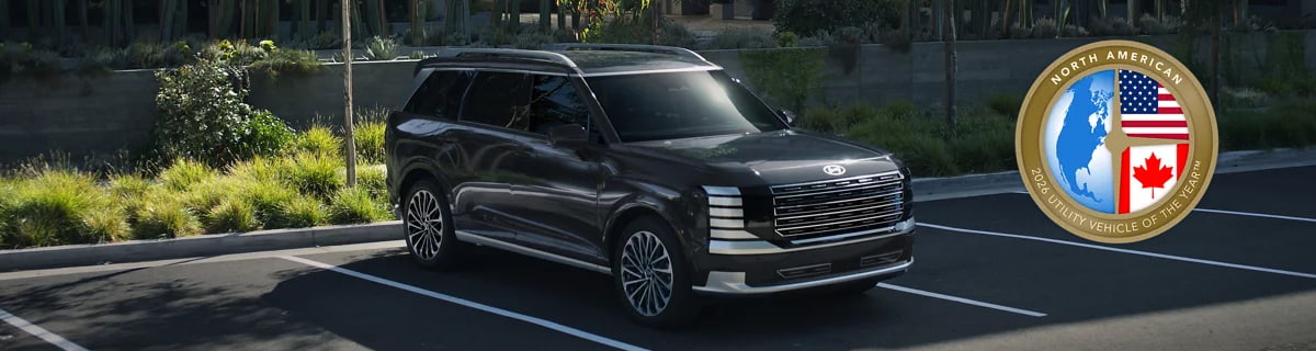 2026 Hyundai Palisade Hybrid shown with award badge for 2026 North American Utility Vehicle of the Year