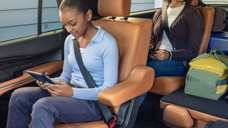 Kid in Ford with Tablet