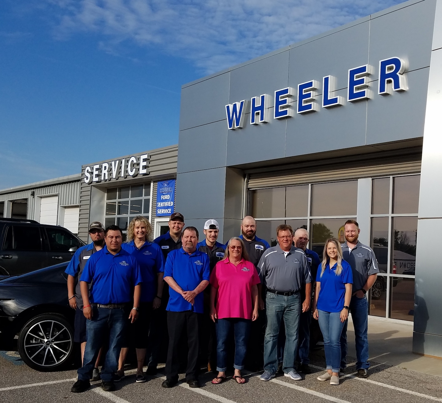  Person cheerfully signing documents.