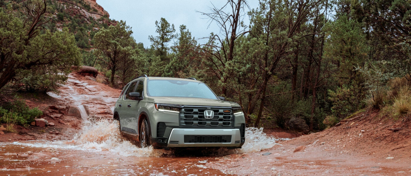 2026Honda-Pilot-ExteriorDrivingThroughStream