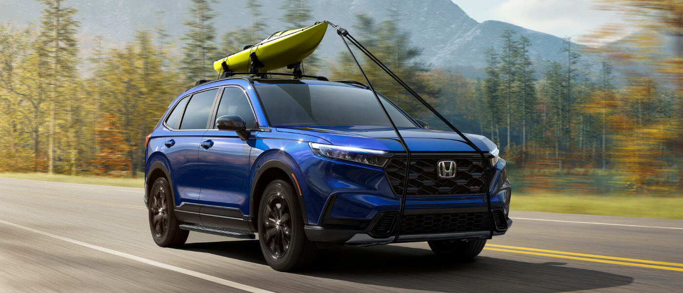 27Honda-CRV-ExteriorWithCanoeOnMountainRoad