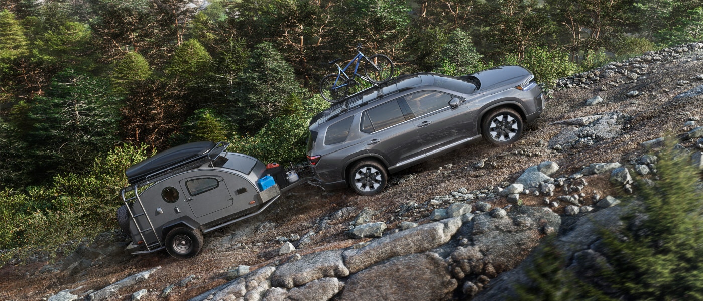 2026Honda-Pilot-ExteriorTowingTrailerUpMountain