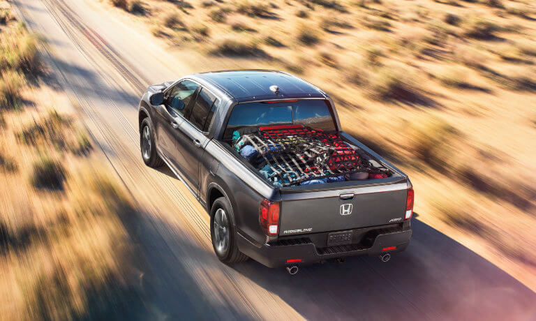 2026Honda-Ridgeline-ExteriorRearViewOnDesertRoad-