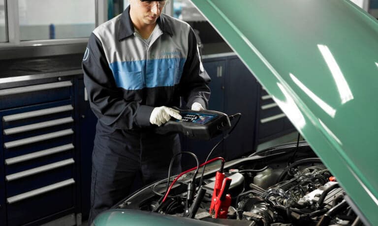 Honda Service Mechanic Testing Battery