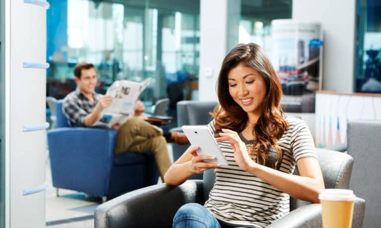 Woman waiting in dealership lobby