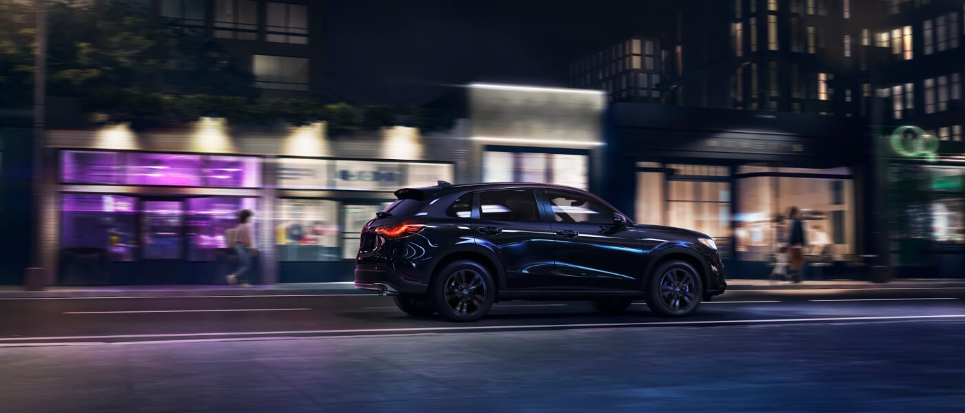2026 Honda HR-V driving in a city at night