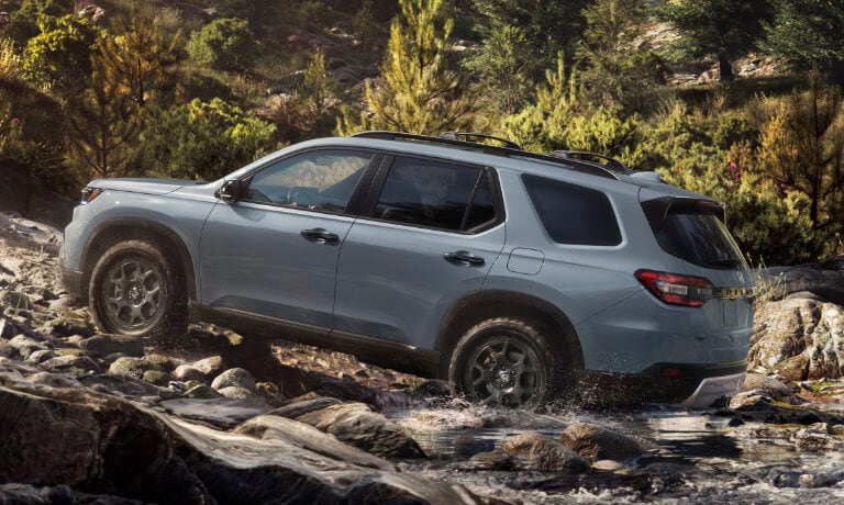2025 Honda Pilot offroading in mountain river