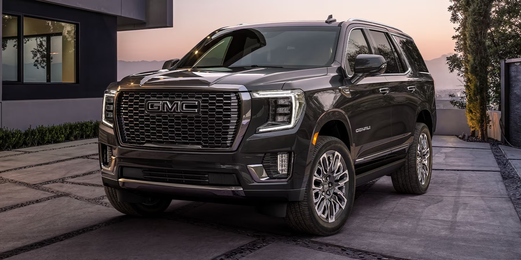White GMC Yukon Denali.jpeg