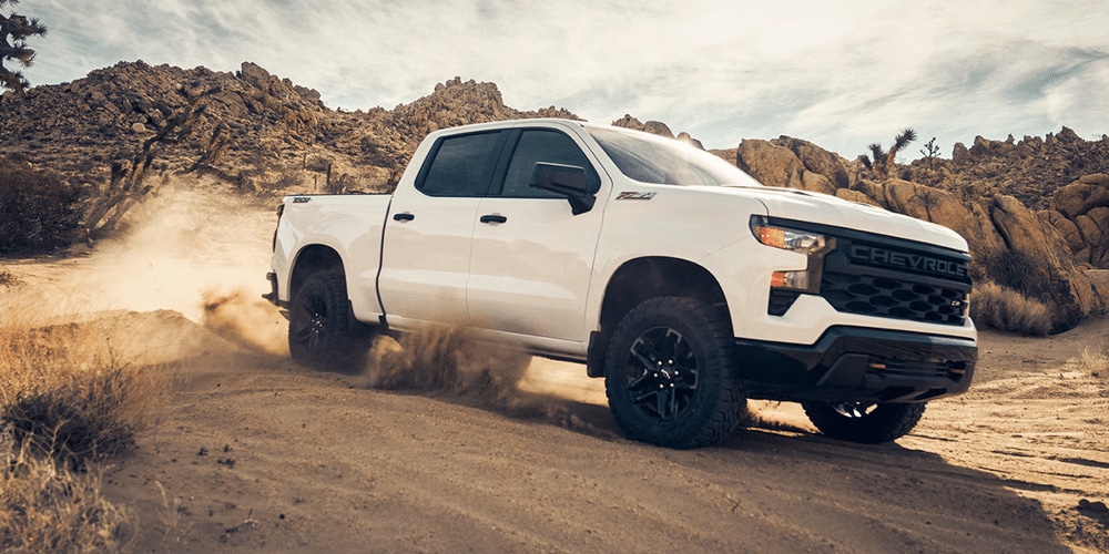 2025 Chevrolet Silverado towing a trailer, demonstrating its powerful performance.