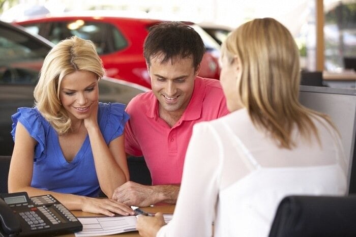 dealer-couple-paperwork.jpg