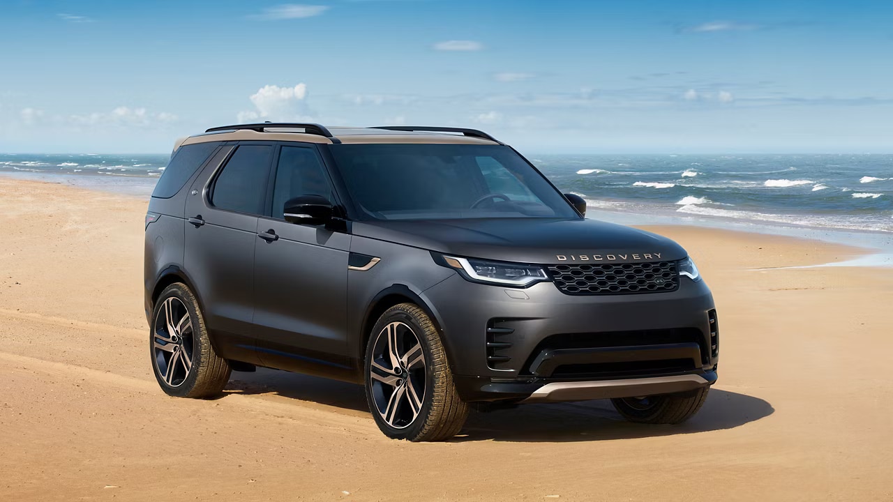 2026 Discovery Tempest by Land Rover, parked on a beach