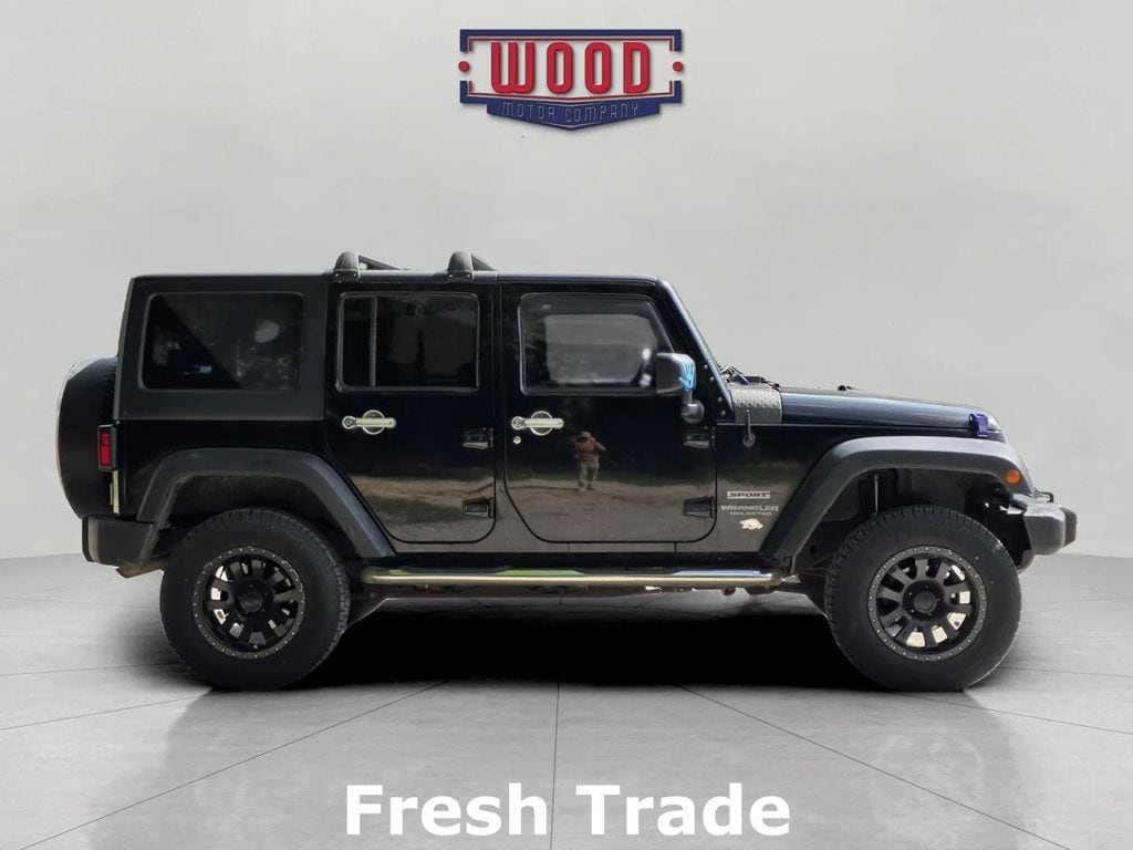 Used 2015 Jeep Wrangler Unlimited Sport with VIN 1C4BJWDG0FL577795 for sale in Harrison, AR