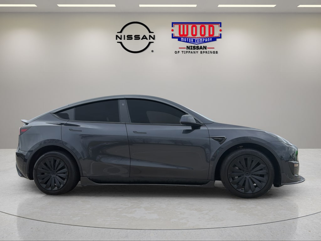Used 2025 Tesla Model Y Long Range with VIN 7SAYGAEE0SF250922 for sale in Kansas City, MO