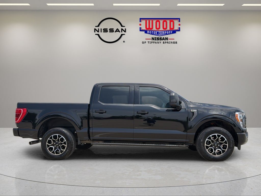 Used 2023 Ford F-150 XLT with VIN 1FTFW1ED5PFA71213 for sale in Kansas City