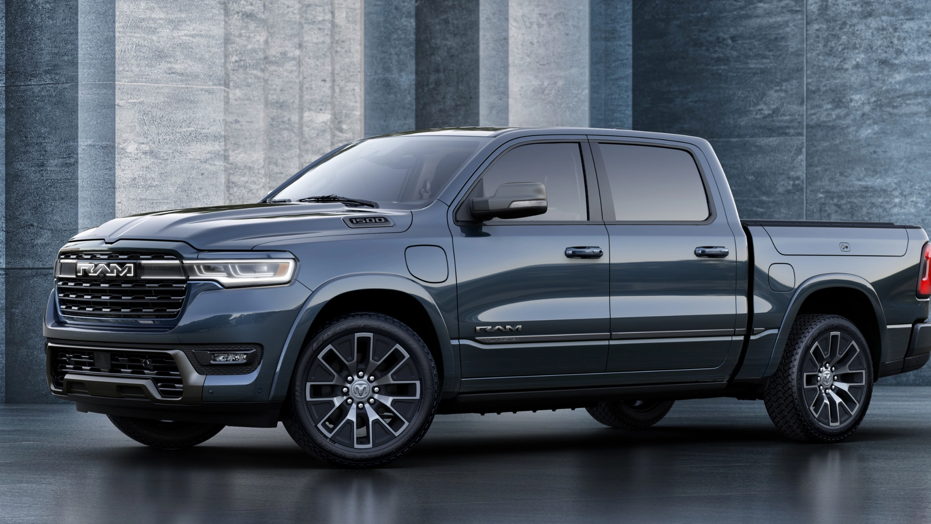 2026 Ram 1500 REV gray pickup side profile with crew cab, plug-in port, and polished wheels