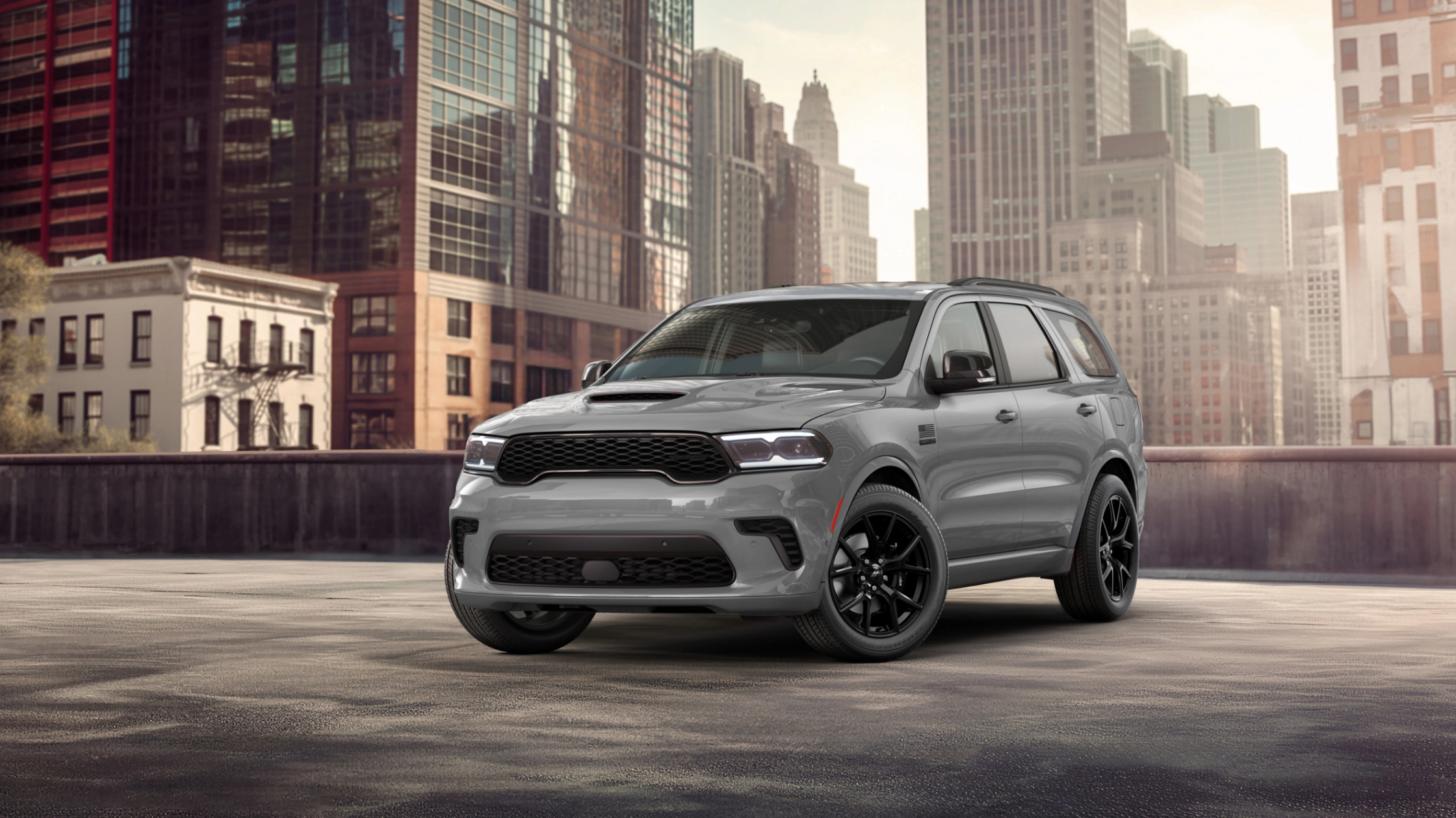 2026 Dodge Durango gray SUV parked in city setting with black wheels and bold grille
