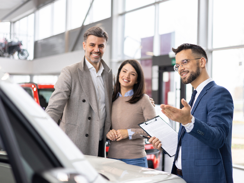 Wyatt Chevrolet GMC Salesperson showing customers a new gmc