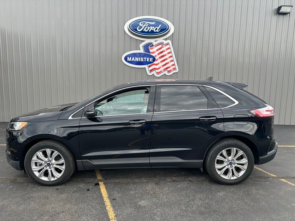 Used 2021 Ford Edge Titanium with VIN 2FMPK4K98MBA40323 for sale in Manistee, MI