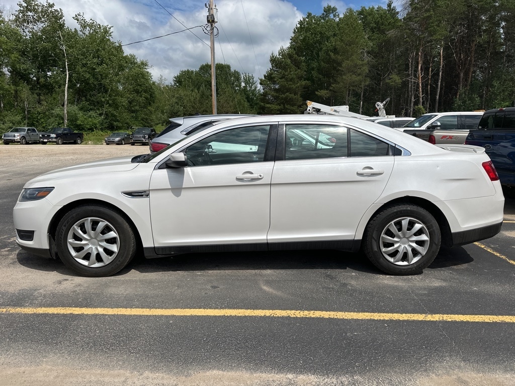 Used 2014 Ford Taurus SEL with VIN 1FAHP2H84EG183928 for sale in Manistee, MI