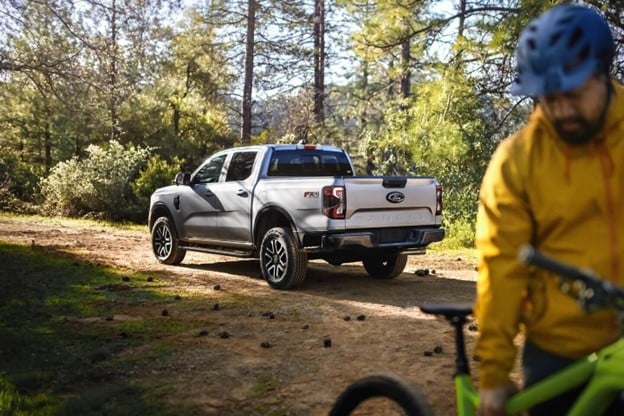 2024%20Ford%20Ranger%20outdoors%20on%20a%20trail%20and%20man%20with%20a%20bike.jpg