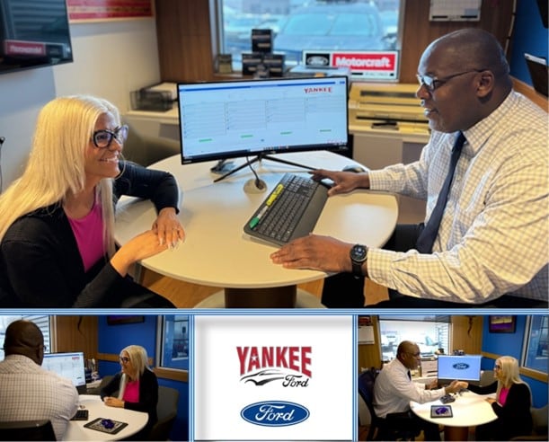 A woman is discussing the finance options with the Yankee Ford professional in South Portland, ME