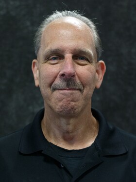 Staff member Chuck Tucker from ID_b3d7cf644a49