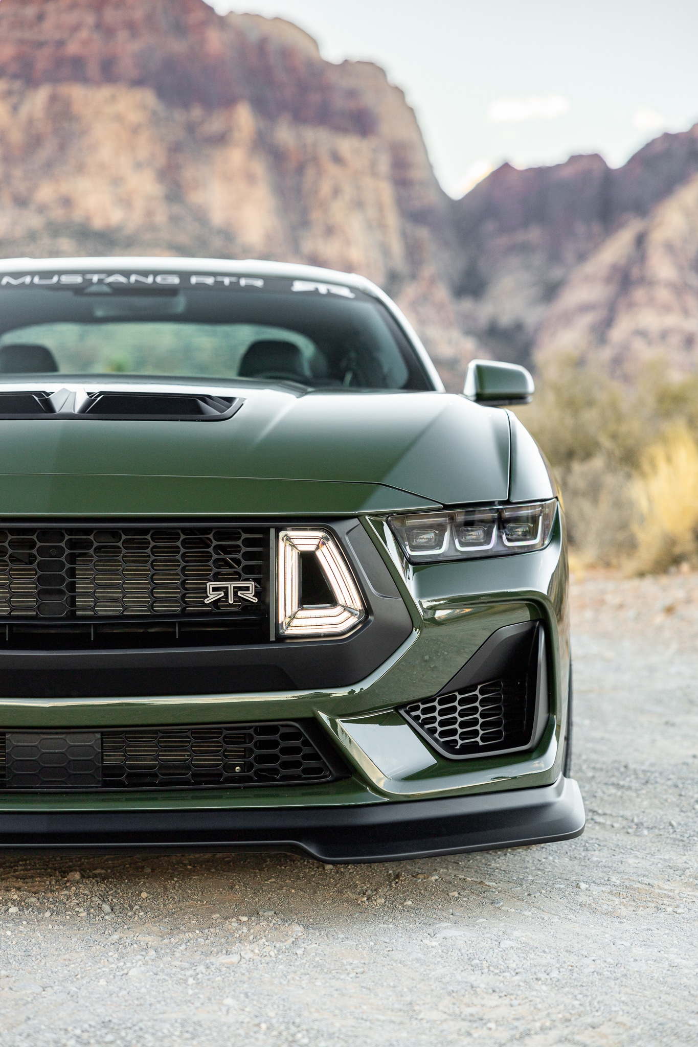 Green Mustang RTR front detail in Utah canyon scenery