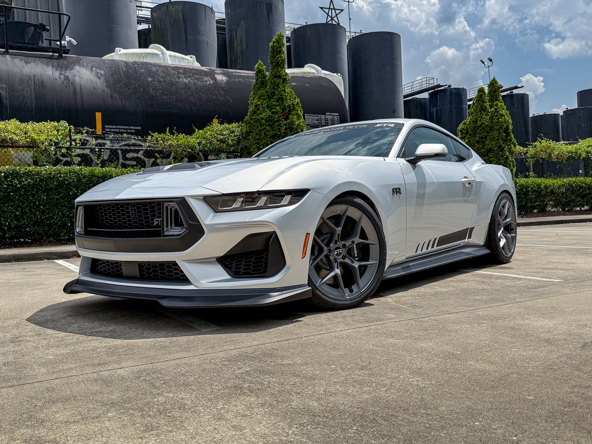 Silver Mustang RTR parked in a city setting