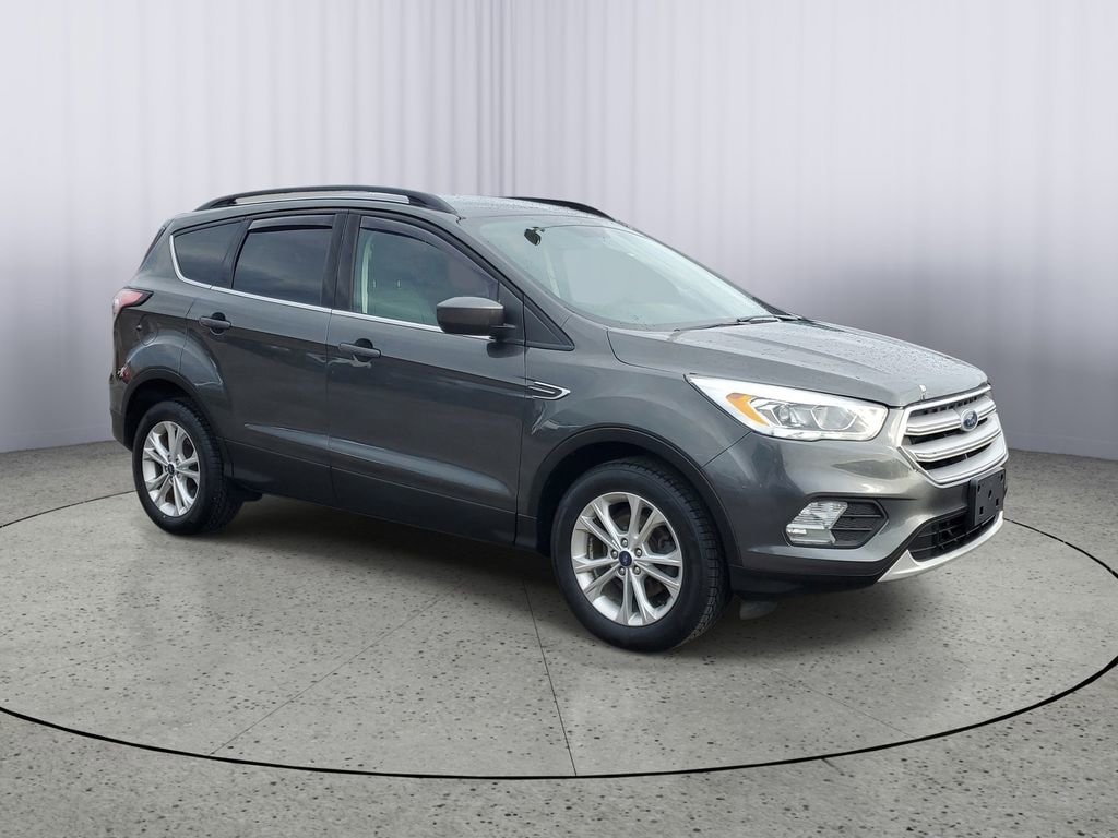 Used 2018 Ford Escape SEL with VIN 1FMCU0HD3JUC17573 for sale in Owosso, MI