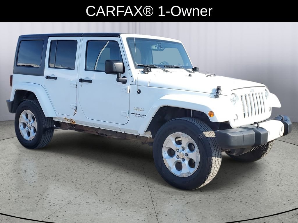 Used 2014 Jeep Wrangler Unlimited Sahara with VIN 1C4BJWEG8EL258092 for sale in Owosso, MI