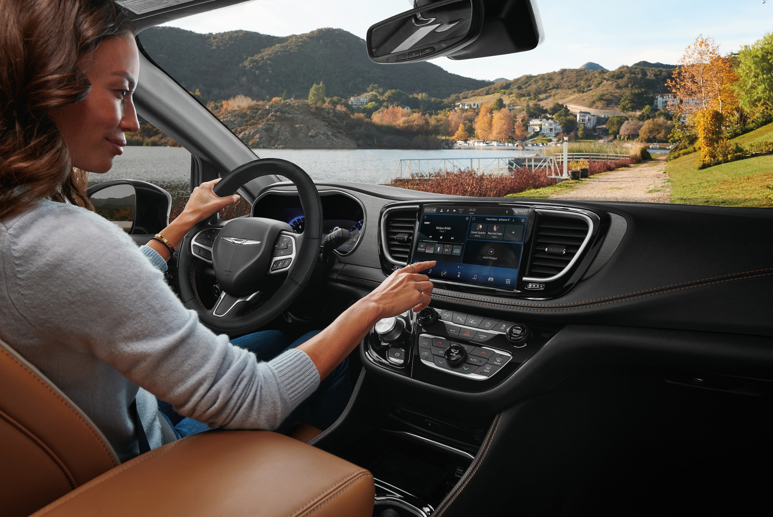 Inside of a Chrysler vehicle with woman driving