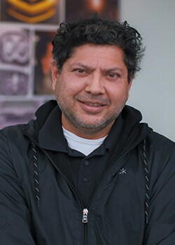 Staff member Juan Delgado from ID_99f9b0ae1268