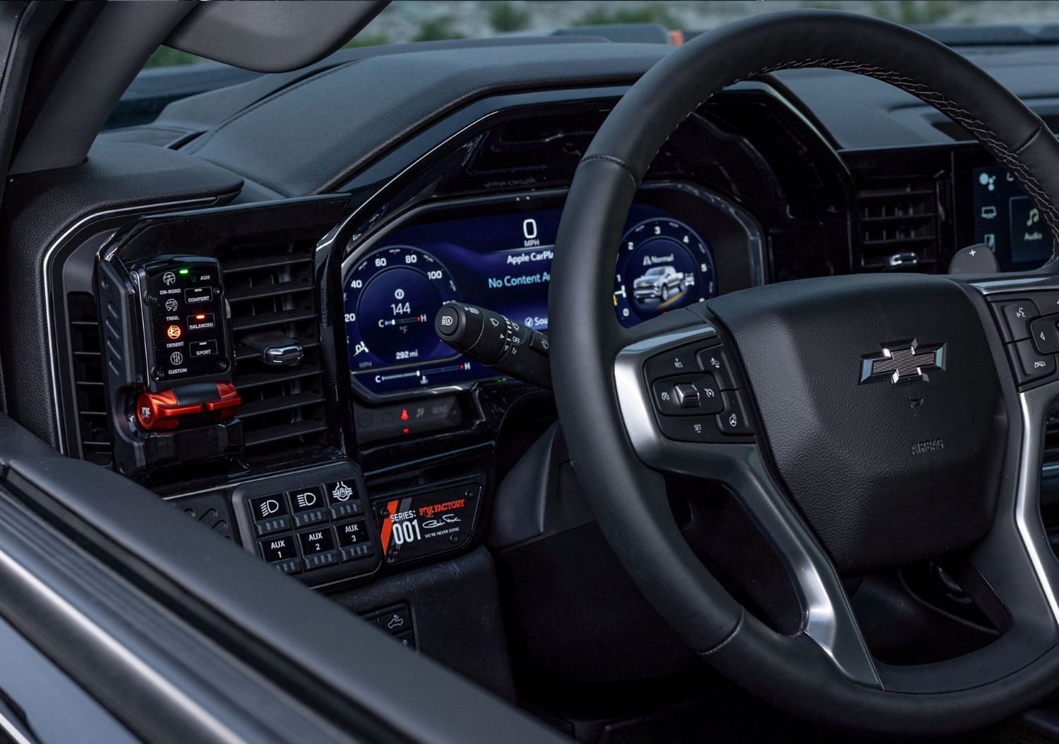13.4-inch infotainment and Fox Live Valve control touchpoints inside a Silverado 1500 build