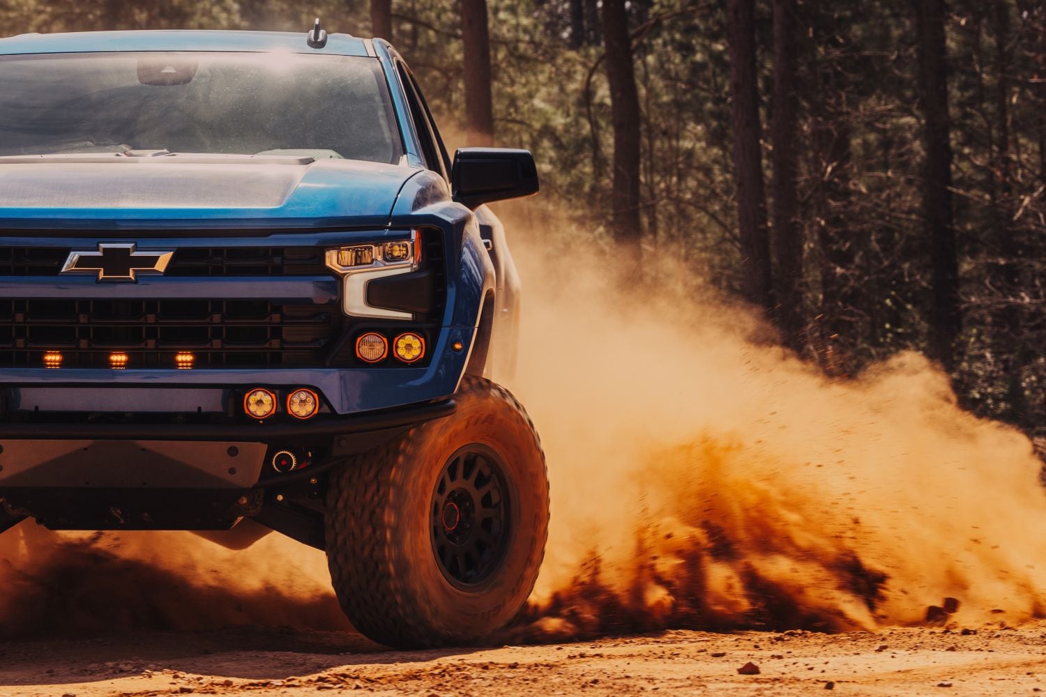 2025 Chevrolet Silverado 1500 Fox Factory build driving through desert dust