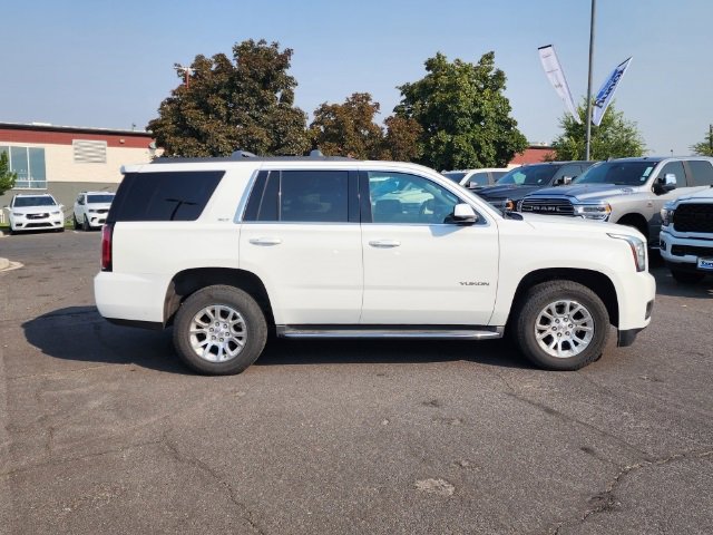 Used 2015 GMC Yukon SLT with VIN 1GKS2BKC9FR222423 for sale in Layton, UT